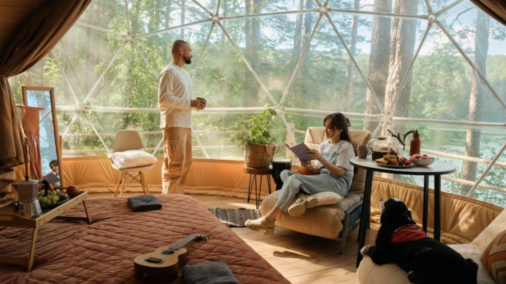 Woman reading a book while man wastes time