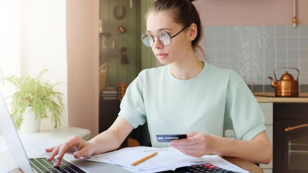 Woman reviewing bills with frustration
