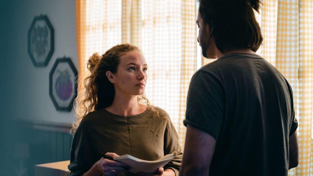 Wife sharing success while husband responds with a lack of enthusiasm