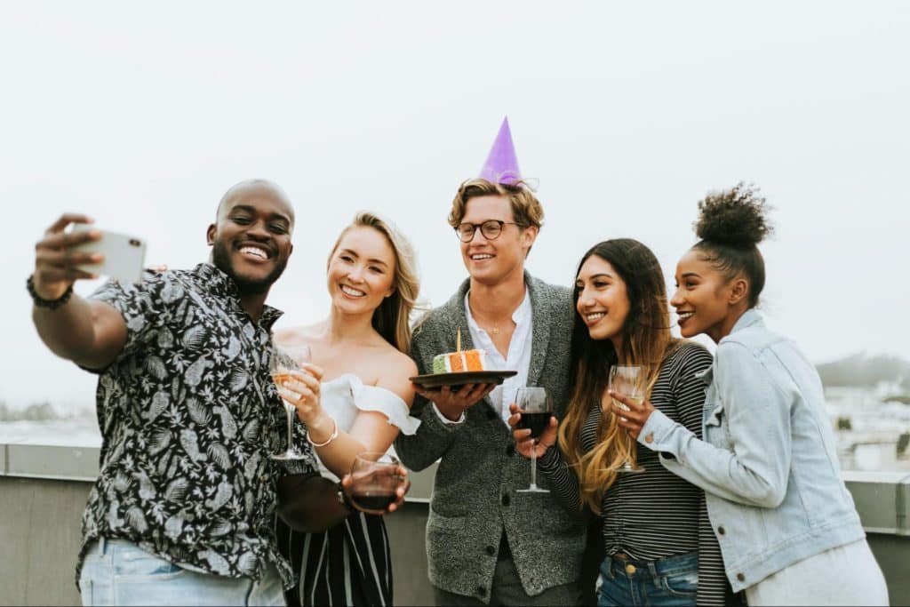 A group of people celebrating birthday