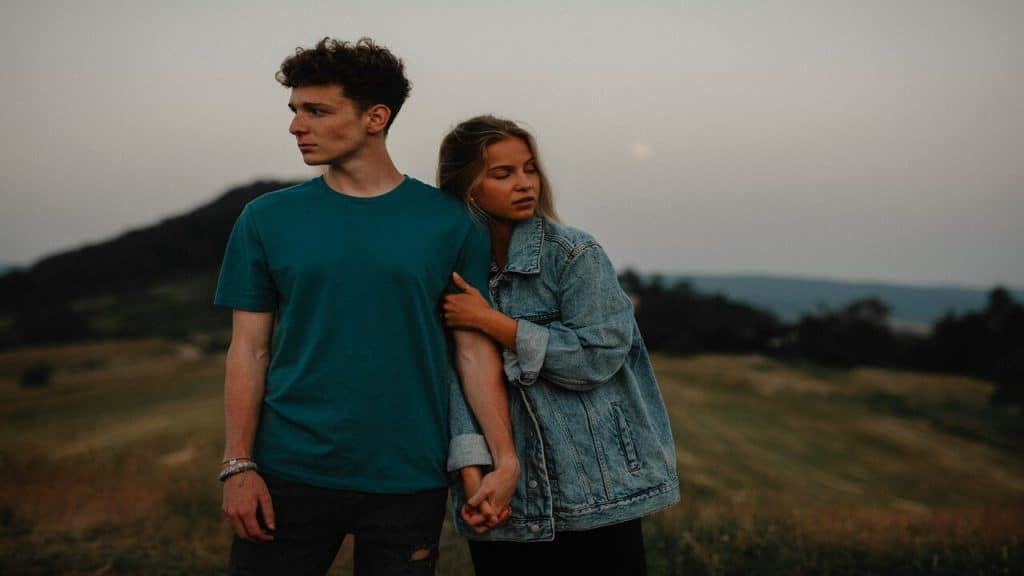 A couple standing on a field