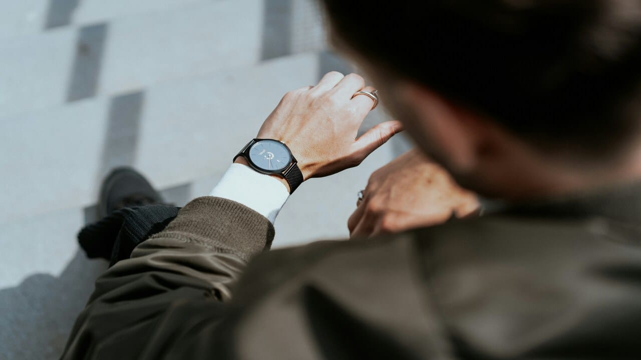 A man looking at his watch.