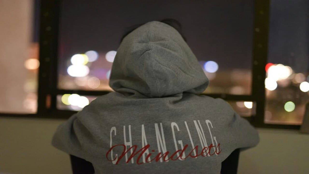 A person wearing a “changing mindsets” hoodie.