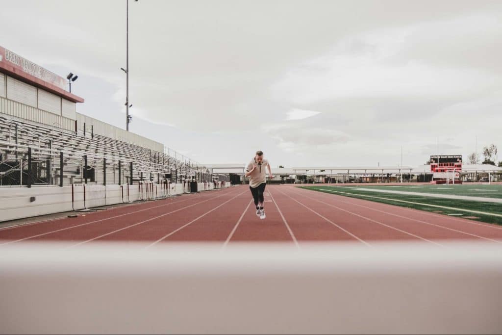 A man running at the track field 