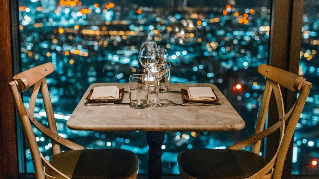 A romantic dinner table with a city view.