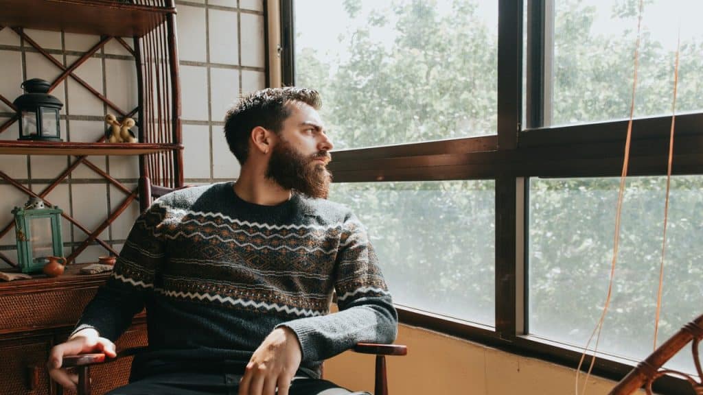 A man looking out the window