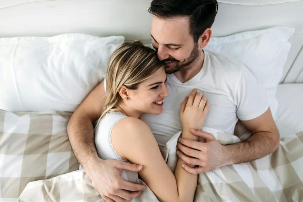 A woman feeling safe on her husband’s arms