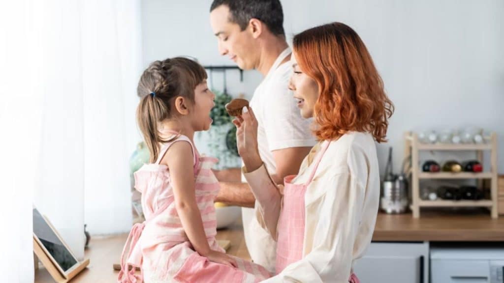 Woman managing the kid while partner ignores them