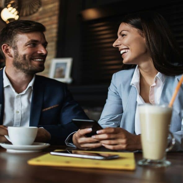 A couple at a cafe.