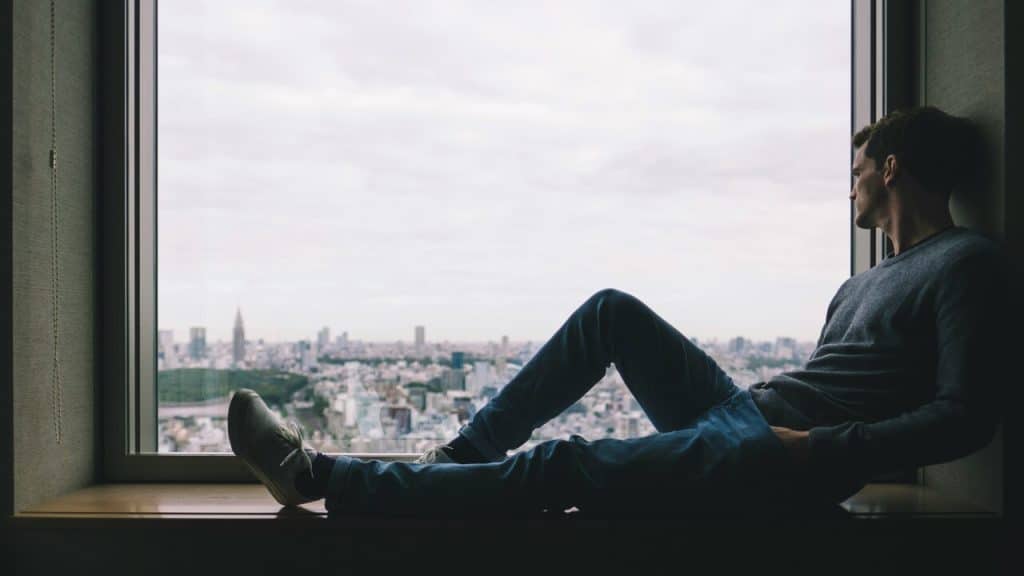 A man sitting by the window