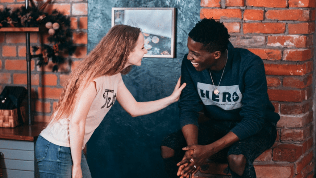 A couple laughing together.