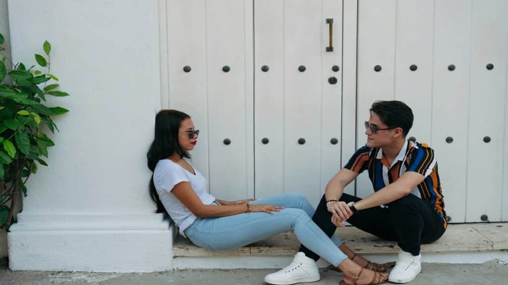 A couple talking outdoors