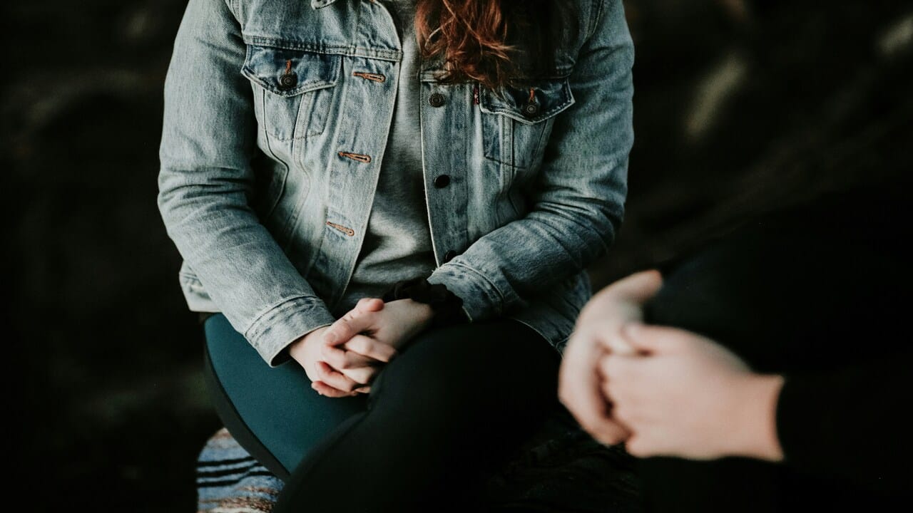 A couple sitting while talking.