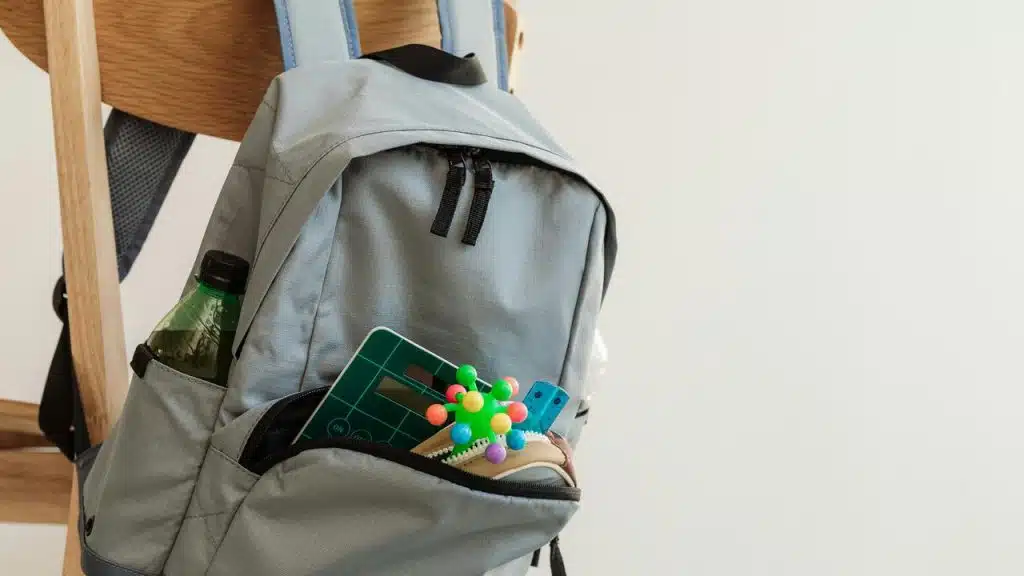 A backpack filled with school supplies.