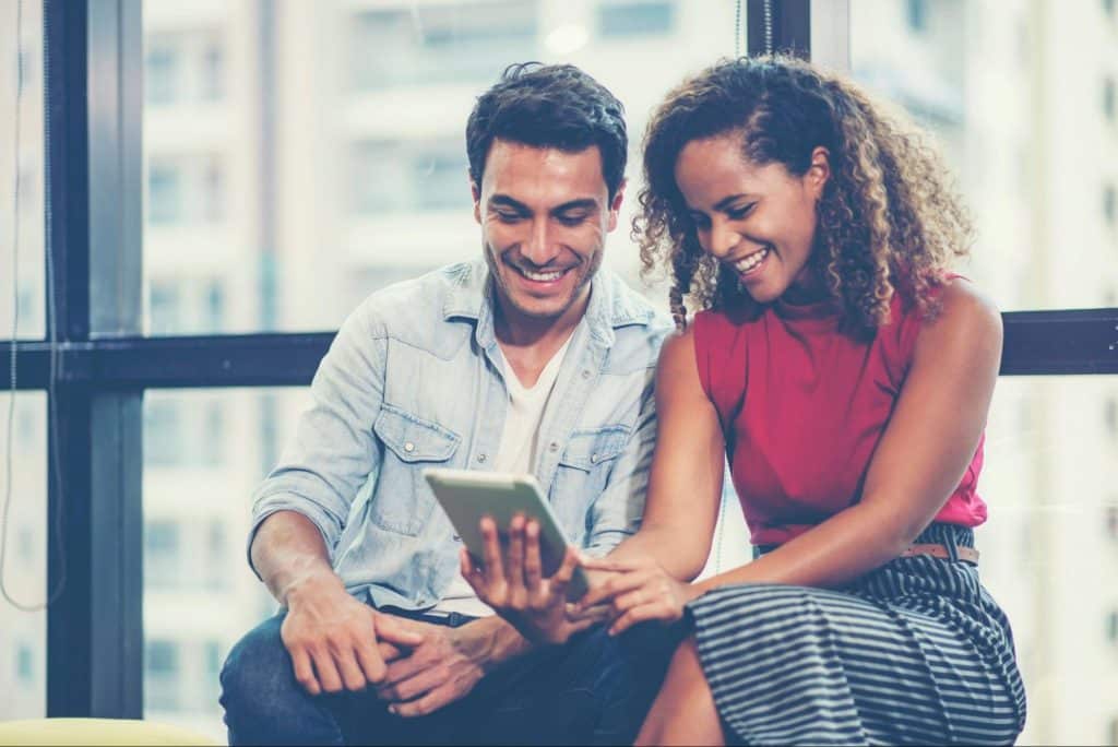 A man and woman checking their shared finance
