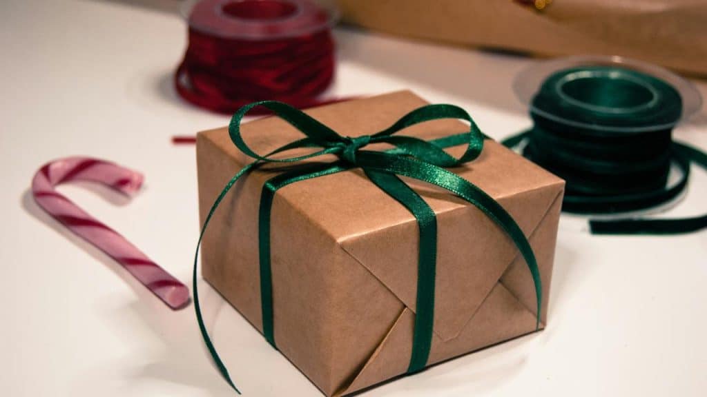 A wrapped gift with a green ribbon.