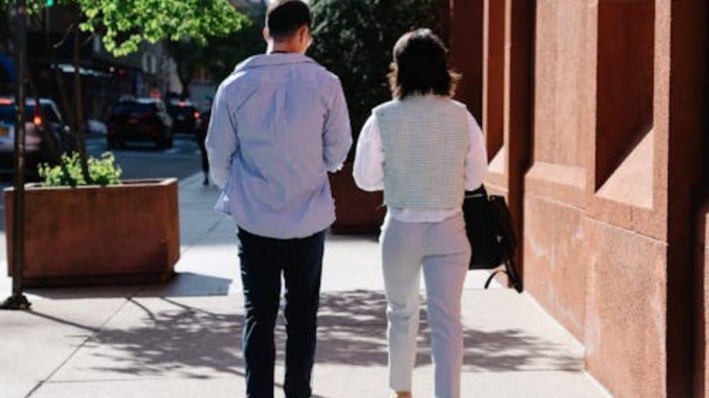 Couple walking side by side without holding hands