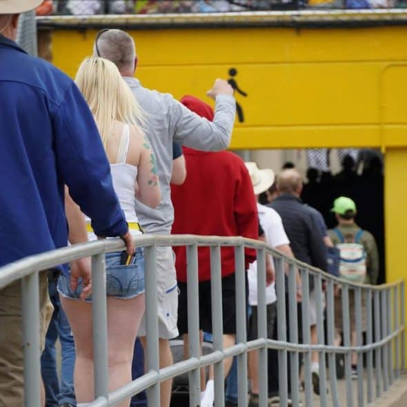 People standing in a queue.