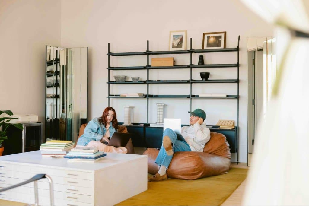 A man and woman adjusting on their shared space