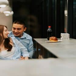 A couple spending time together at a cafe.