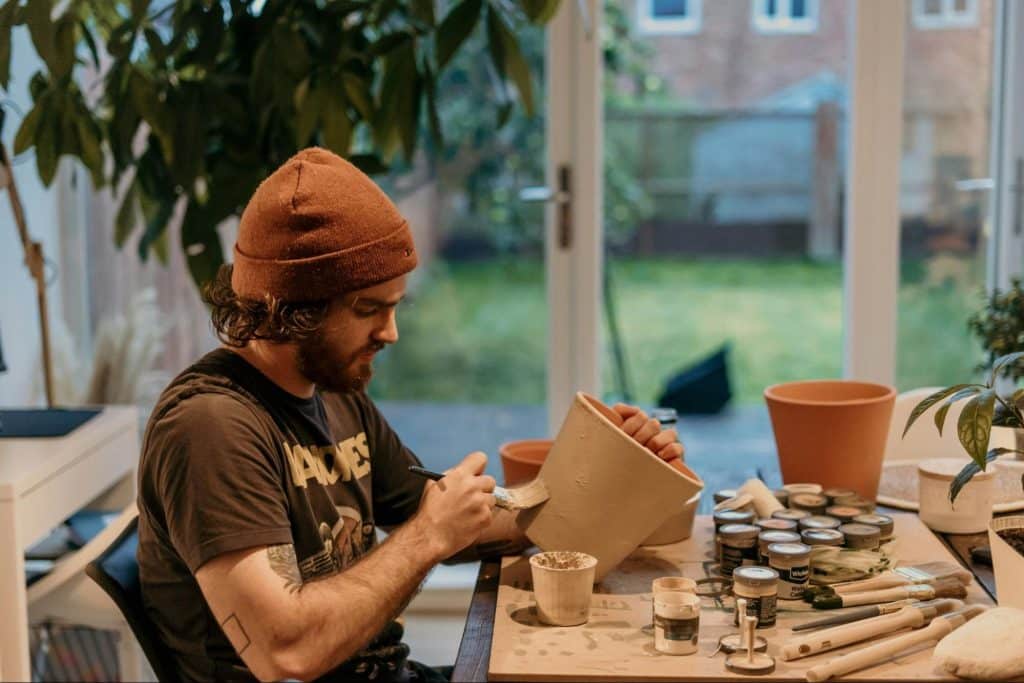 A man doing pottery alone