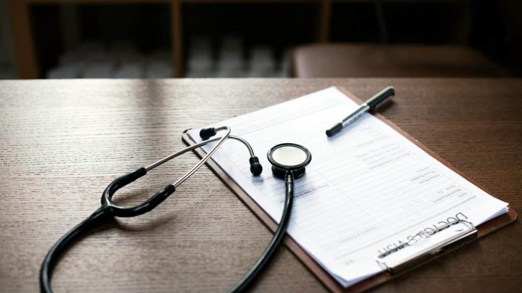 A stethoscope on a medical form.