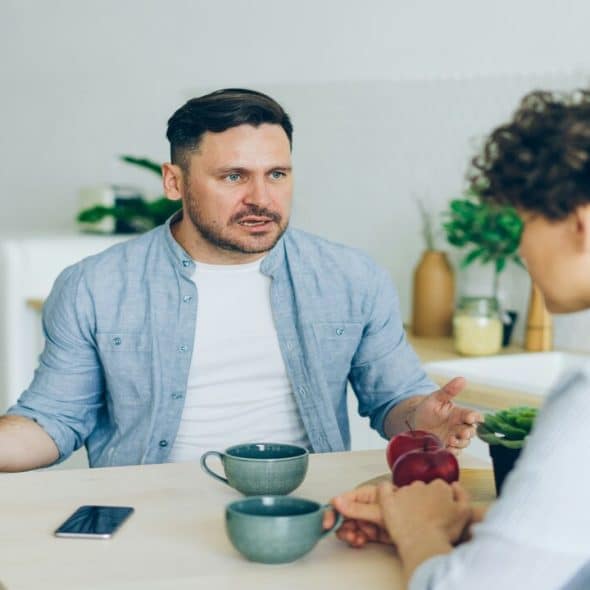 A man and a woman having a serious conversation