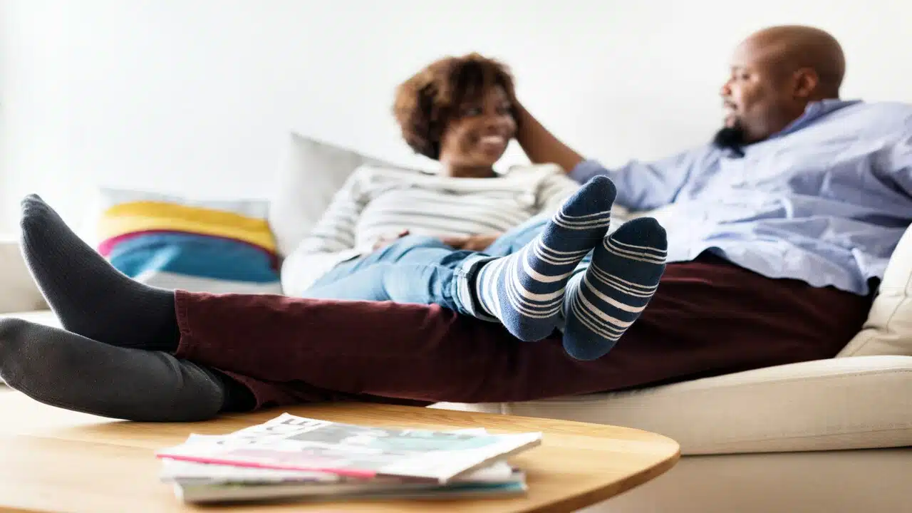 A couple talking at home.