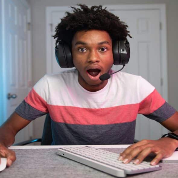 A young man playing computer games
