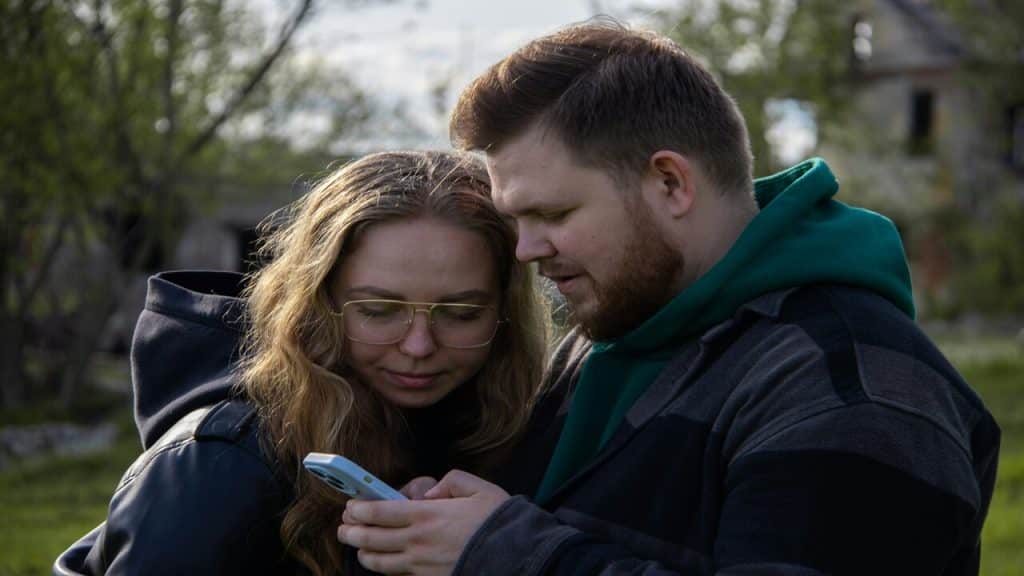 A couple looking at a phone