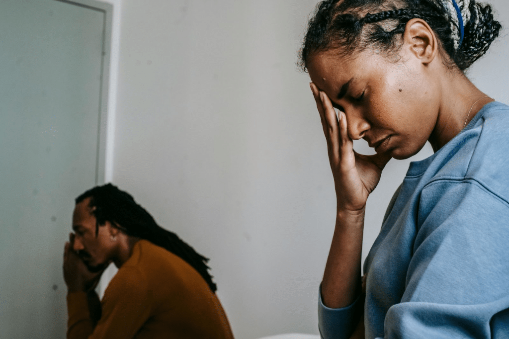 A man and woman at annoyed at each other 