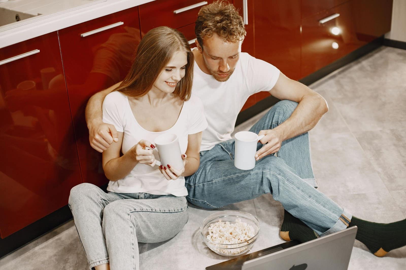 A man and woman watching a movie.