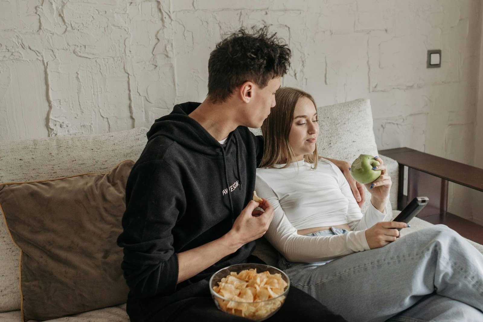 A woman holding a remote.