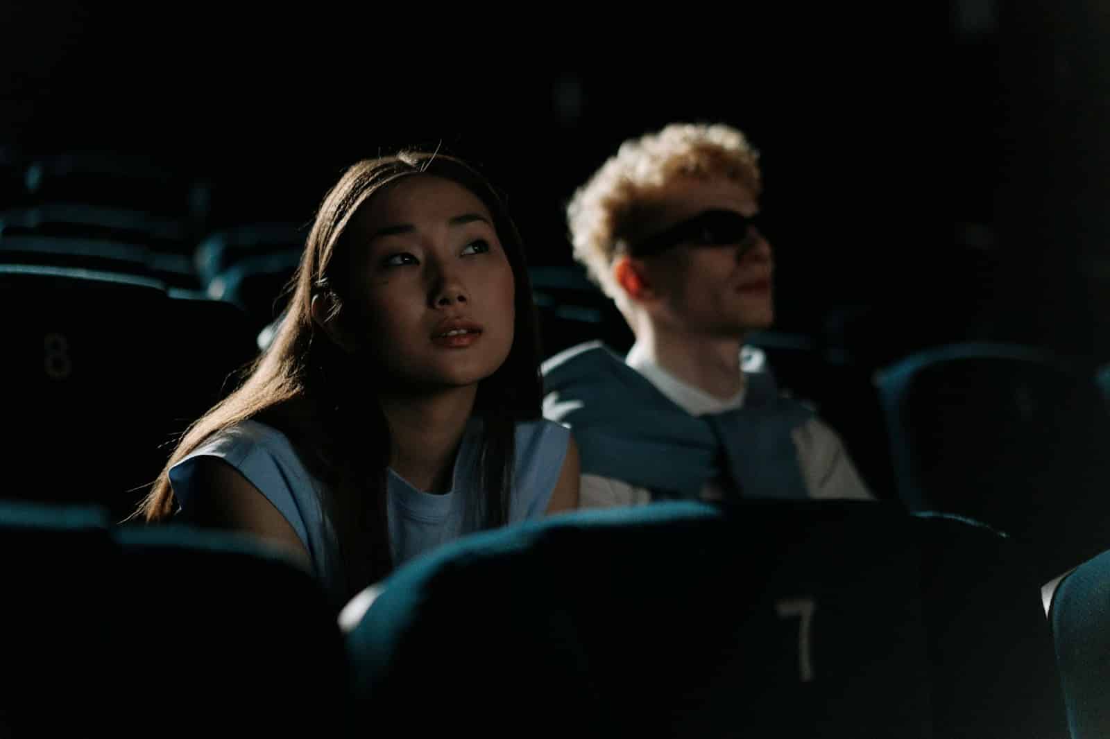 A man and woman very focus on the scene.