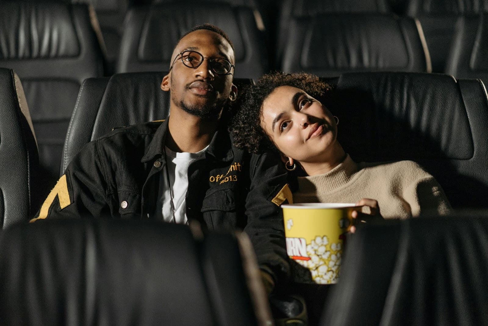 A man and woman happy watching.