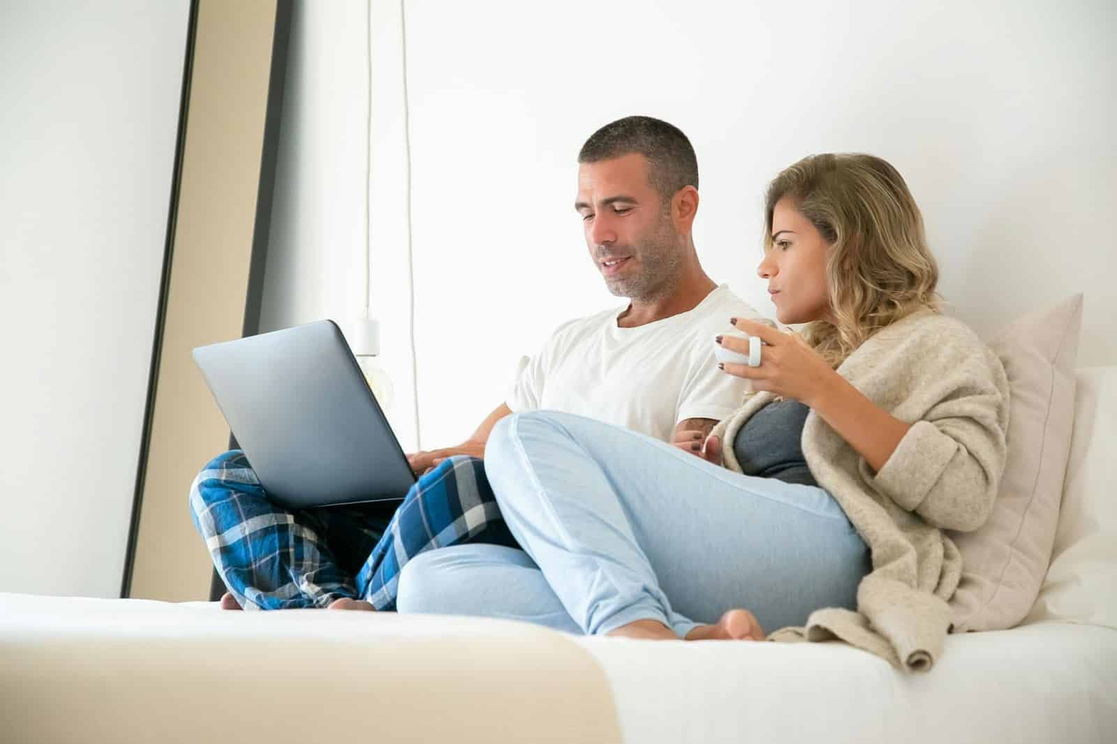A man and woman checking schedules.