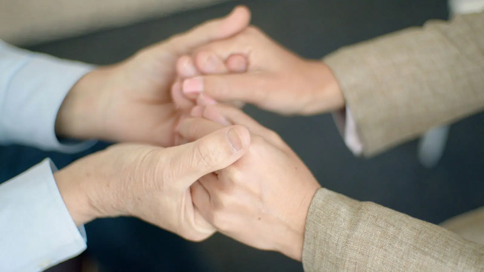 A man and woman holding hands.