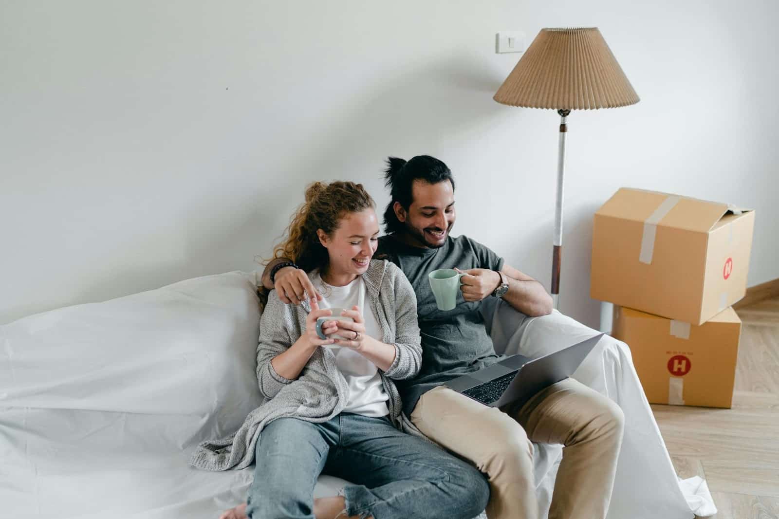 A man and woman sharing thoughts while watching a movie.