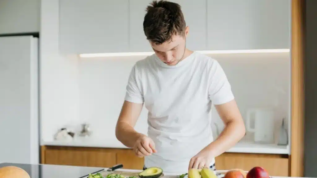 Man cooking a healthy meal in a bright kitchen