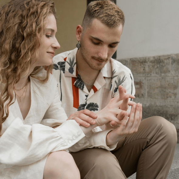 A man and woman holding hands