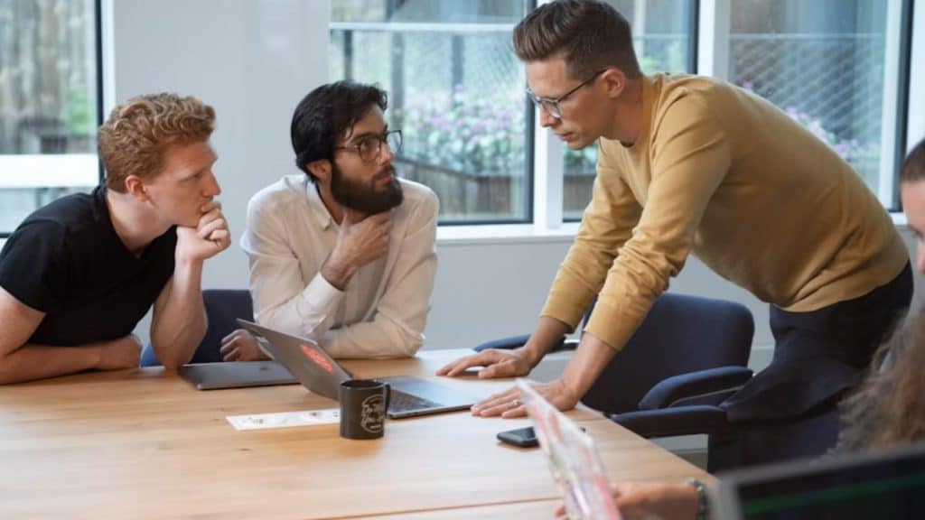 Man openly admitting a mistake in a team meeting