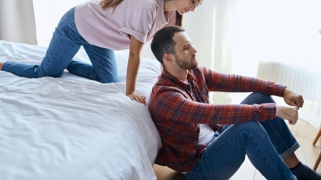 Husband staring at the wall, clearly overwhelmed by stress