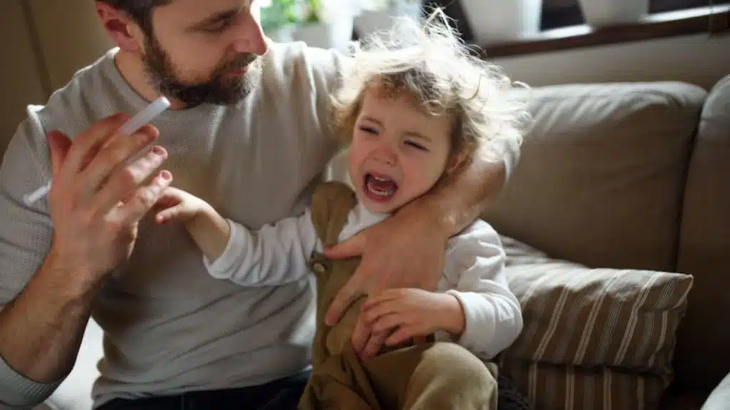 Father scolding a child while looking stressed