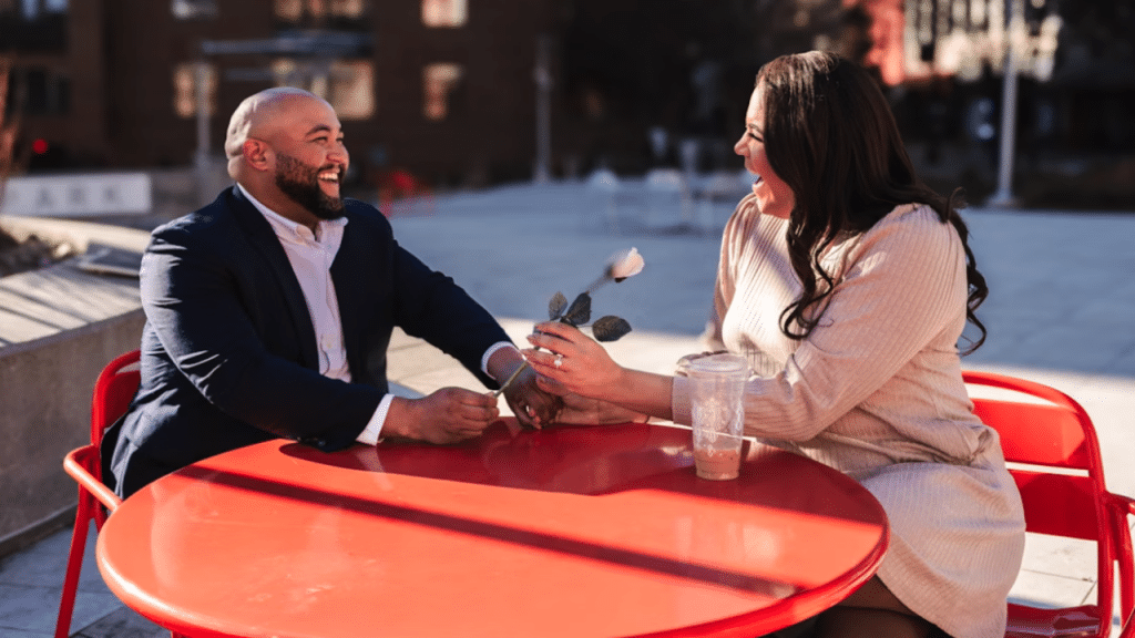 A man giving his wife a rose