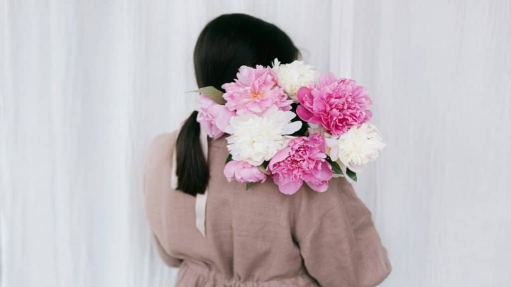 A woman holding a bouquet