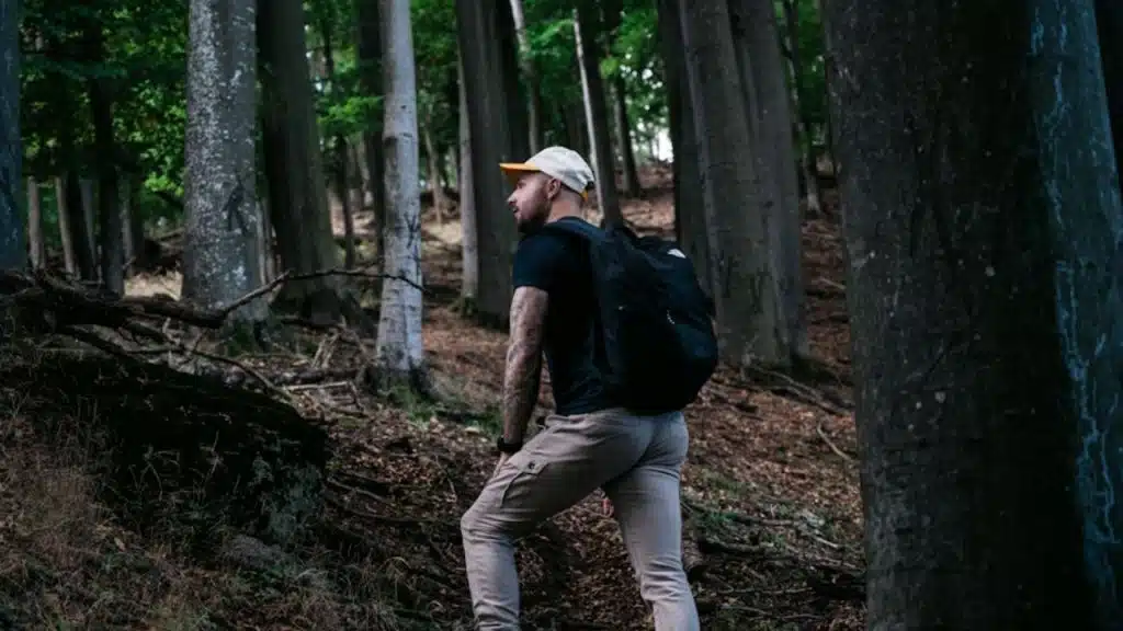 Man taking a solo walk in nature to decompress