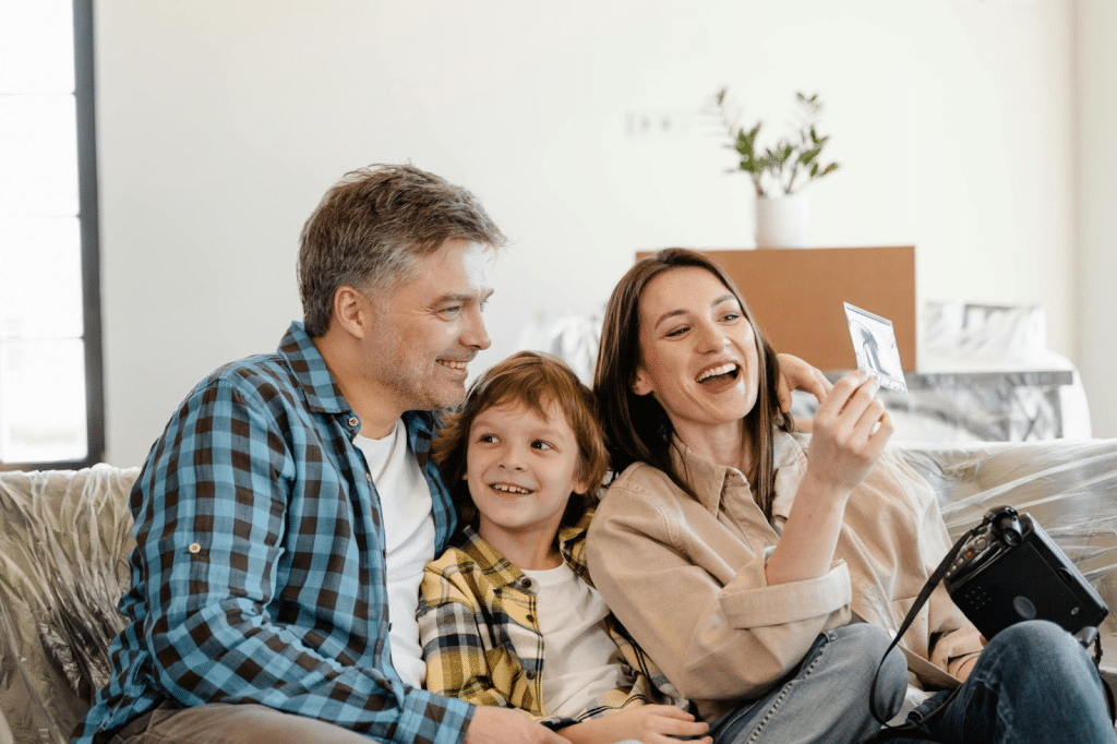 A man and woman with their kid