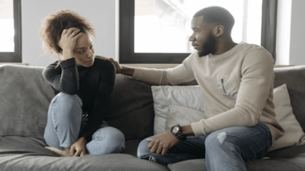 A couple having a serious talk at home