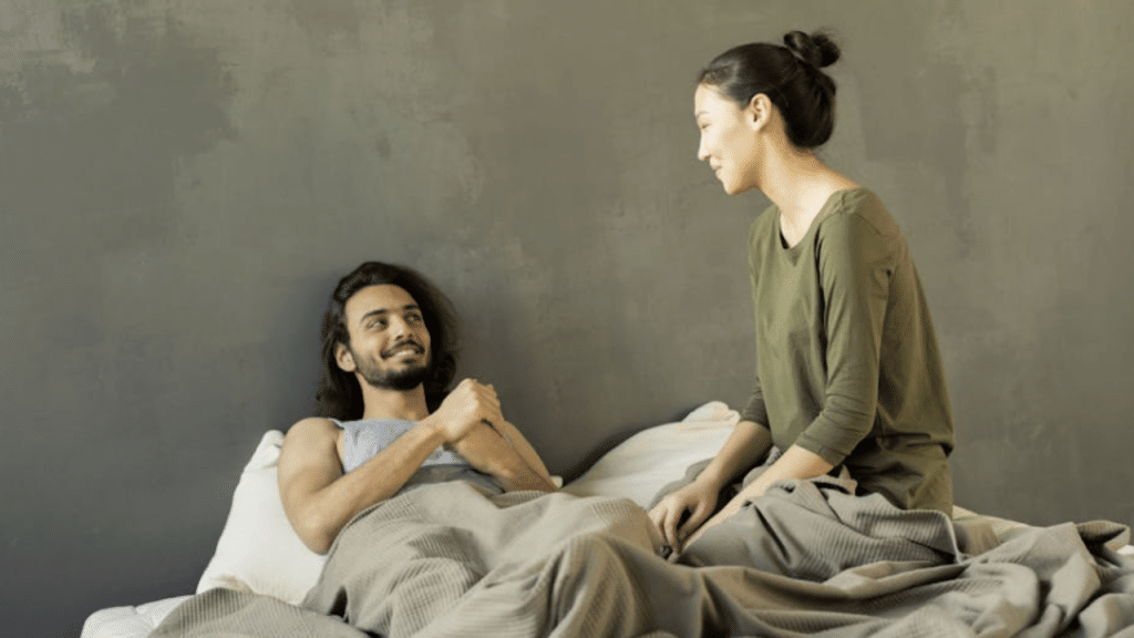 A couple talking in bed