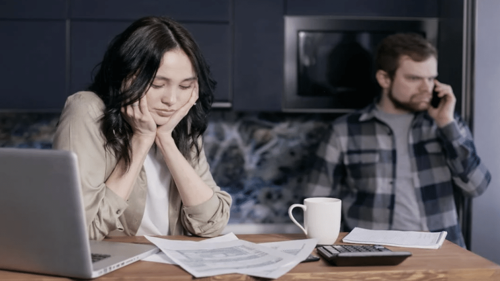 A couple stressed about their bills